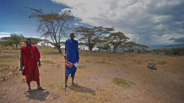 Two Masai Tribe members posing for a picture